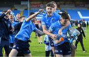 18 May 2022; Dublin captain Clyde Burke is ambushed by team-mates in celebration while speaking to TG4 after the Electric Ireland Leinster GAA Minor Football Championship Final match between Dublin and Kildare at MW Hire O'Moore Park in Portlaoise, Laois. Photo by Stephen McCarthy/Sportsfile