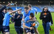 18 May 2022; Dublin captain Clyde Burke is ambushed by team-mates in celebration while speaking to TG4 after the Electric Ireland Leinster GAA Minor Football Championship Final match between Dublin and Kildare at MW Hire O'Moore Park in Portlaoise, Laois. Photo by Stephen McCarthy/Sportsfile