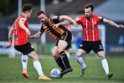 20 May 2022; Robbie Benson of Dundalk in action against Cameron Dummigan, right, and Matty Smith of Derry City during the SSE Airtricity League Premier Division match between Derry City and Dundalk at The Ryan McBride Brandywell Stadium in Derry. Photo by Ben McShane/Sportsfile