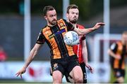 20 May 2022; Robbie Benson of Dundalk in action against Cameron Dummigan of Derry City during the SSE Airtricity League Premier Division match between Derry City and Dundalk at The Ryan McBride Brandywell Stadium in Derry. Photo by Ben McShane/Sportsfile