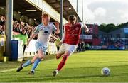 20 May 2022; Shane Farrell of Shelbourne goes past Chris Forrester of St Patrick's Athletic during the SSE Airtricity League Premier Division match between St Patrick's Athletic and Shelbourne at Richmond Park in Dublin. Photo by Eóin Noonan/Sportsfile