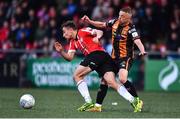 20 May 2022; Joe Thomson of Derry City is fouled by Keith Ward of Dundalk during the SSE Airtricity League Premier Division match between Derry City and Dundalk at The Ryan McBride Brandywell Stadium in Derry. Photo by Ben McShane/Sportsfile