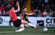 20 May 2022; Patrick Hoban of Dundalk shoots to score his side's second goal despite the attention of Eoin Toal of Derry City during the SSE Airtricity League Premier Division match between Derry City and Dundalk at The Ryan McBride Brandywell Stadium in Derry. Photo by Ben McShane/Sportsfile