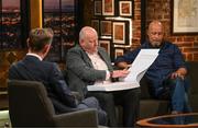 20 May 2022; John Charlton, son of the late Jack Charlton, Republic of Ireland manager, after being presented with a Book of Condolence by former Republic of Ireland international Paul McGrath, right, as The Late Late Show presenter Ryan Tubridy watches on during the FAI Centenary Late Late Show Special at RTE Studios in Dublin. Photo by Stephen McCarthy/Sportsfile