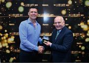 20 May 2022; FAI president Gerry McAnaney presents former Republic of Ireland international Niall Quinn with an FAI centenary medal during the FAI Centenary Late Late Show Special at RTE Studios in Dublin. Photo by Stephen McCarthy/Sportsfile