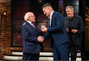 20 May 2022; President of Ireland Michael D Higgins presents former Republic of Ireland international Shay Given with an FAI centenary medal during the FAI Centenary Late Late Show Special at RTE Studios in Dublin. Photo by Stephen McCarthy/Sportsfile
