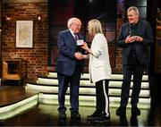 20 May 2022; President of Ireland Michael D Higgins presents former Republic of Ireland international Olivia O’Toole with an FAI centenary medal during the FAI Centenary Late Late Show Special at RTE Studios in Dublin. Photo by Stephen McCarthy/Sportsfile