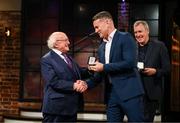 20 May 2022; President of Ireland Michael D Higgins presents former Republic of Ireland international Shay Given with an FAI centenary medal during the FAI Centenary Late Late Show Special at RTE Studios in Dublin. Photo by Stephen McCarthy/Sportsfile