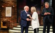 20 May 2022; President of Ireland Michael D Higgins presents former Republic of Ireland international Olivia O’Toole with an FAI centenary medal during the FAI Centenary Late Late Show Special at RTE Studios in Dublin. Photo by Stephen McCarthy/Sportsfile