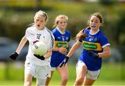 21 May 2022; Aoibheann Birchall of Kildare in action against Kate Nevin  of Tipperary during theLadies Football U14 All-Ireland Gold Final match between Kildare and Tipperary at Crettyard GAA in Laois. Photo by Ray McManus/Sportsfile