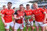 21 May 2022; Louth players, from left, Conor Quigley, Ruairí Morrissey, Peter Fortune and Pádraig Fallon celebrate with the cup after their side's victory in the Lory Meagher Cup Final match between Longford and Louth at Croke Park in Dublin. Photo by Piaras Ó Mídheach/Sportsfile