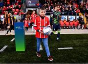 20 May 2022; Jamie McCormick, son of late Derry City supporter Edgar McCormick, takes the match ball from the plinth before the SSE Airtricity League Premier Division match between Derry City and Dundalk at The Ryan McBride Brandywell Stadium in Derry. Photo by Ben McShane/Sportsfile