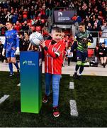 20 May 2022; Jamie McCormick, son of late Derry City supporter Edgar McCormick, takes the match ball from the plinth before the SSE Airtricity League Premier Division match between Derry City and Dundalk at The Ryan McBride Brandywell Stadium in Derry. Photo by Ben McShane/Sportsfile