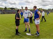 21 May 2022; Waterford captain Michael Curry indicates which way his side will play after winning the toss with Wicklow captain Dean Healy and referee David Coldrick ahead of the Tailteann Cup Preliminary Round match between Wicklow and Waterford at County Grounds in Aughrim, Wicklow. Photo by Daire Brennan/Sportsfile