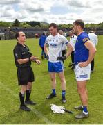 21 May 2022; Waterford captain Michael Curry and Wicklow captain Dean Healy watch referee David Coldrick do the toss ahead of the Tailteann Cup Preliminary Round match between Wicklow and Waterford at County Grounds in Aughrim, Wicklow. Photo by Daire Brennan/Sportsfile