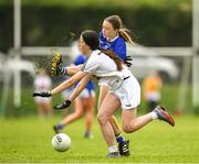 21 May 2022; Abbie Horgan of Tipperary in action against Jessica McNulty of Kildare during theLadies Football U14 All-Ireland Gold Final match between Kildare and Tipperary at Crettyard GAA in Laois. Photo by Ray McManus/Sportsfile