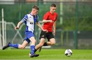 21 May 2022; Harry Quilligan of College Corinthians AFC in action against Nathan O'Kelly of Corduff FC during the FAI Centenary Under 17 Cup Final 2021/2022 match between Corduff FC, Dublin, and College Corinthians AFC, Cork, at Home Farm Football Club in Dublin. Photo by Brendan Moran/Sportsfile