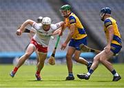 21 May 2022; Lorcan Devlin of Tyrone in action against Roscommon players Hugh Rooney and Cathal Dolan, right, during the Nickey Rackard Cup Final match between Roscommon and Tyrone at Croke Park in Dublin. Photo by Piaras Ó Mídheach/Sportsfile