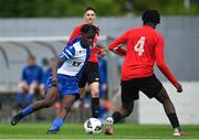 21 May 2022; Harvey Skieters of College Corinthians AFC in action against Eddie Amusat of Corduff FC during the FAI Centenary Under 17 Cup Final 2021/2022 match between Corduff FC, Dublin, and College Corinthians AFC, Cork, at Home Farm Football Club in Dublin. Photo by Brendan Moran/Sportsfile