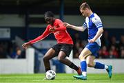 21 May 2022; Eddie Amusat of Corduff FC in action against Jerry Murphy of College Corinthians AFC during the FAI Centenary Under 17 Cup Final 2021/2022 match between Corduff FC, Dublin, and College Corinthians AFC, Cork, at Home Farm Football Club in Dublin. Photo by Brendan Moran/Sportsfile