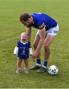 21 May 2022; Fia Healy, aged 1, with her dad Dean Healy, after the Tailteann Cup Preliminary Round match between Wicklow and Waterford at County Grounds in Aughrim, Wicklow. Photo by Daire Brennan/Sportsfile