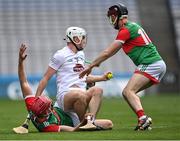 21 May 2022; Conan Boran of Kildare in action against Mayo players Joseph Mooney, left, and Seán Kenny during the Christy Ring Cup Final match between Kildare and Mayo at Croke Park in Dublin. Photo by Piaras Ó Mídheach/Sportsfile