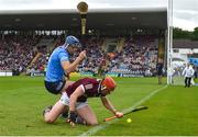 21 May 2022; Conor Whelan of Galway tries to prevent the ball from going over the end line despite the challenge from Eoghan O’Donnell of Dublin during the Leinster GAA Hurling Senior Championship Round 5 match between Galway and Dublin at Pearse Stadium in Galway. Photo by Ray Ryan/Sportsfile