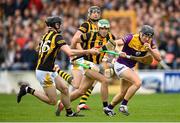 21 May 2022; Liam Óg McGovern of Wexford in action against Paddy Deegan, 7, and Tom Phelan of Kilkenny during the Leinster GAA Hurling Senior Championship Round 5 match between Kilkenny and Wexford at UPMC Nowlan Park in Kilkenny. Photo by Stephen McCarthy/Sportsfile