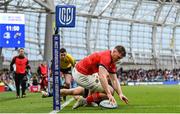 21 May 2022; Jack O'Donoghue of Munster scores his side's first try despite the tackle of Cormac Foley of Leinster during the United Rugby Championship match between Leinster and Munster at the Aviva Stadium in Dublin. Photo by Harry Murphy/Sportsfile
