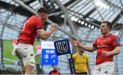 21 May 2022; Jack O'Donoghue of Munster celebrates with teammate Andrew Conway after scoring his side's first try during the United Rugby Championship match between Leinster and Munster at the Aviva Stadium in Dublin. Photo by Harry Murphy/Sportsfile