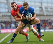 21 May 2022; Jordan Larmour of Leinster is tackled by Andrew Conway of Munster during the United Rugby Championship match between Leinster and Munster at the Aviva Stadium in Dublin. Photo by Harry Murphy/Sportsfile