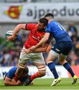 21 May 2022; Jean Kleyn of Munster is tackled by Scott Penny and Harry Byrne of Leinster during the United Rugby Championship match between Leinster and Munster at the Aviva Stadium in Dublin. Photo by Harry Murphy/Sportsfile