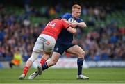 21 May 2022; Ciarán Frawley of Leinster is tackled by Andrew Conway of Munster during the United Rugby Championship match between Leinster and Munster at Aviva Stadium in Dublin. Photo by Brendan Moran/Sportsfile