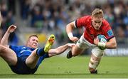 21 May 2022; Mike Haley of Munster is tackled by Rory O'Loughlin of Leinster during the United Rugby Championship match between Leinster and Munster at the Aviva Stadium in Dublin. Photo by Harry Murphy/Sportsfile