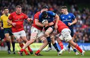 21 May 2022; Ryan Baird of Leinster is tackled by Thomas Ahern and Alex Kendellen of Munster during the United Rugby Championship match between Leinster and Munster at Aviva Stadium in Dublin. Photo by Brendan Moran/Sportsfile