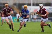 21 May 2022; James Keyes of Laois in action against Robbie Greville, right, and Nial Mitchell of Westmeath during the Leinster GAA Hurling Senior Championship Round 5 match between Laois and Westmeath at MW Hire O’Moore Park in Portlaoise, Laois. Photo by Michael P Ryan/Sportsfile