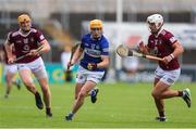 21 May 2022; James Keyes of Laois in action against Robbie Greville, right, and Nial Mitchell of Westmeath during the Leinster GAA Hurling Senior Championship Round 5 match between Laois and Westmeath at MW Hire O’Moore Park in Portlaoise, Laois. Photo by Michael P Ryan/Sportsfile