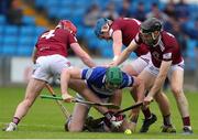 21 May 2022; Paddy Purcell of Laois battles for possession against Darragh Egerton, left, Tommy Doyle, and Cormac Boyle, right, during the Leinster GAA Hurling Senior Championship Round 5 match between Laois and Westmeath at MW Hire O’Moore Park in Portlaoise, Laois. Photo by Michael P Ryan/Sportsfile