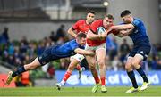 21 May 2022; Chris Farrell of Munster is tackled by Rory O'Loughlin, left, and Harry Byrne of Leinster during the United Rugby Championship match between Leinster and Munster at the Aviva Stadium in Dublin. Photo by Harry Murphy/Sportsfile