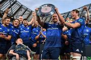 21 May 2022; Leinster captain Ed Byrne lifts the Irish Shield in the company of teammates and Leinster supporter Matthew McGrath after the United Rugby Championship match between Leinster and Munster at Aviva Stadium in Dublin. Photo by Brendan Moran/Sportsfile