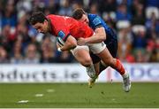 21 May 2022; Joey Carbery of Munster is tackled by Rory O'Loughlin of Leinster during the United Rugby Championship match between Leinster and Munster at Aviva Stadium in Dublin. Photo by Brendan Moran/Sportsfile