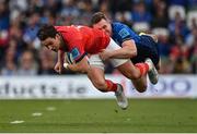 21 May 2022; Joey Carbery of Munster is tackled by Rory O'Loughlin of Leinster during the United Rugby Championship match between Leinster and Munster at Aviva Stadium in Dublin. Photo by Brendan Moran/Sportsfile