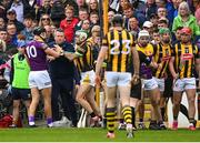 21 May 2022; Wexford manager Darragh Egan stands between Jack O'Connor of Wexford and Paddy Deegan of Kilkenny during the Leinster GAA Hurling Senior Championship Round 5 match between Kilkenny and Wexford at UPMC Nowlan Park in Kilkenny. Photo by Stephen McCarthy/Sportsfile