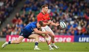 21 May 2022; Rory Scannell of Munster is tackled by Rob Russell of Leinster during the United Rugby Championship match between Leinster and Munster at Aviva Stadium in Dublin. Photo by Brendan Moran/Sportsfile