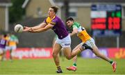 22 May 2022; Liam Coleman of Wexford in action against Ruairi McNamee of Offaly during the Tailteann Cup Preliminary Round match between Wexford and Offaly at Bellefield in Enniscorthy, Wexford. Photo by Brendan Moran/Sportsfile