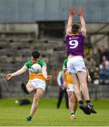 22 May 2022; Bill Carroll of Offaly in action against Niall Hughes of Wexford during the Tailteann Cup Preliminary Round match between Wexford and Offaly at Bellefield in Enniscorthy, Wexford. Photo by Brendan Moran/Sportsfile
