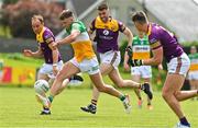 22 May 2022; Keith O'Neill of Offaly in action against Wexford players, Kevin O'Grady, Dean O'Toole and Gavin Sheehan during the Tailteann Cup Preliminary Round match between Wexford and Offaly at Bellefield in Enniscorthy, Wexford. Photo by Brendan Moran/Sportsfile