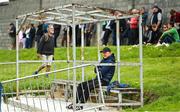 22 May 2022; Offaly manager John Maughan sits in the substitutes dugout before the Tailteann Cup Preliminary Round match between Wexford and Offaly at Bellefield in Enniscorthy, Wexford. Photo by Brendan Moran/Sportsfile