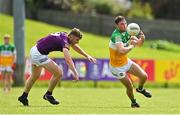 22 May 2022; Jordan Hayes of Offaly in action against Niall Hughes of Wexford during the Tailteann Cup Preliminary Round match between Wexford and Offaly at Bellefield in Enniscorthy, Wexford. Photo by Brendan Moran/Sportsfile