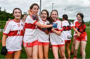 22 May 2022; Derry players, from left, Eimear Nash, Caitlin McGuckin, Ava McPeake and Áine Young celebrate after their victory in the 2022 All-Ireland U14 Bronze Final between Derry and Offaly at the GAA National Games Development Centre in Abbotstown, Dublin. Photo by Ben McShane/Sportsfile